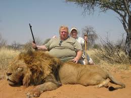Obese Hunter ‘Tests His Courage’ Against Distant, Limping, Near Blind Lion