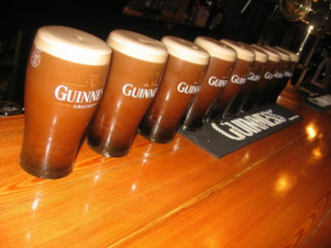 row of pints of guinness